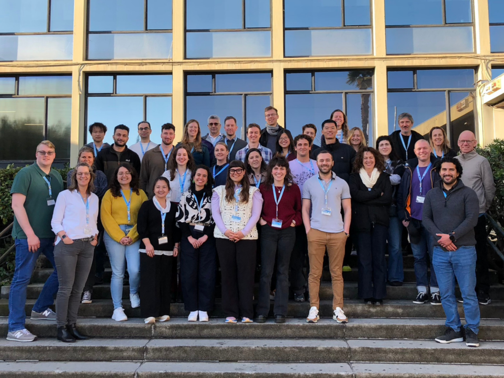 A group photo with all the participants of the Winter School 2026, in the stairs in front of the Faculty of Economics.