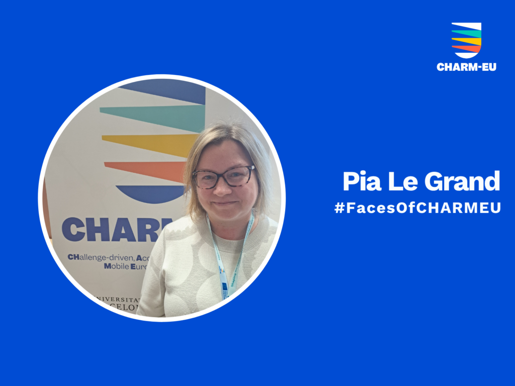 A graphic for the #FacesOfCHARMEU series featuring a circular portrait of Pia Le Grand against a solid blue background. She is a woman with blonde hair and glasses, smiling while wearing a patterned light-colored top and a lanyard, standing in front of a CHARM-EU banner. To the right of the portrait, the white text reads "Pia Le Grand" followed by "#FacesOfCHARMEU", with the multi-colored CHARM-EU alliance logo located in the top right corner.