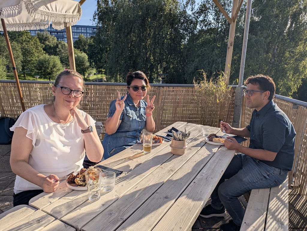 Group of people eating outside. 