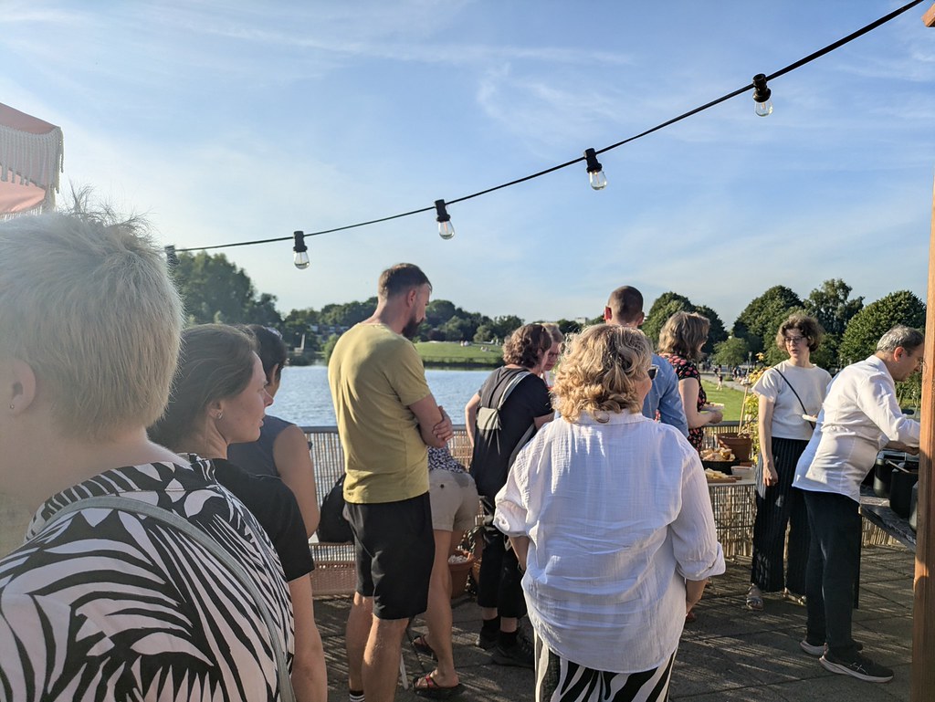 Group of people standing outside. 