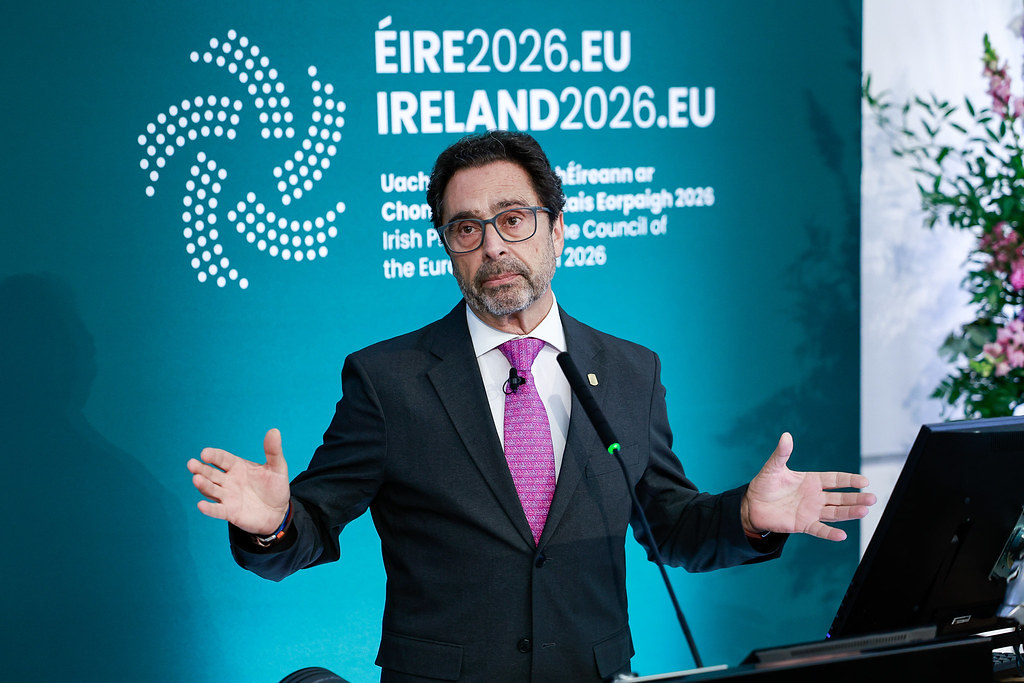 University of Barcelona Rector delivering a presentation at the 4th Forum of the European Universities Initiative, with Ireland 2026 Presidency branding in the background.