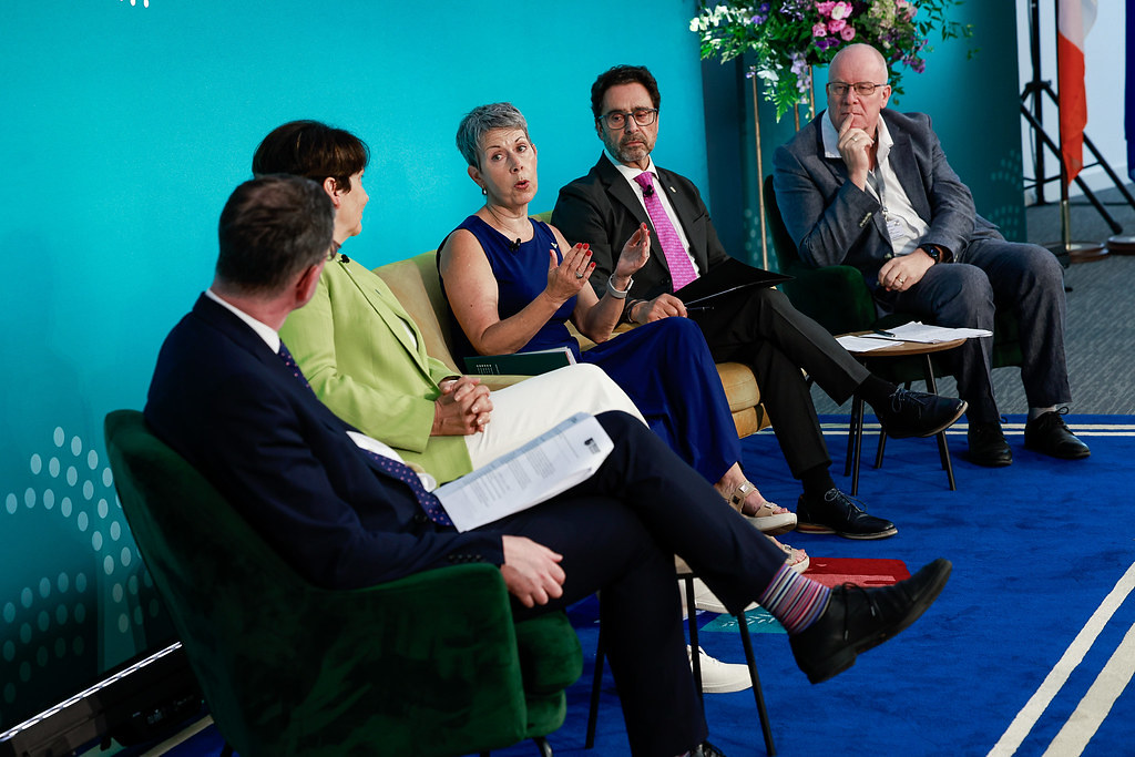 Speakers participating in a panel discussion on stage during the 4th Forum of the European Universities Initiative.