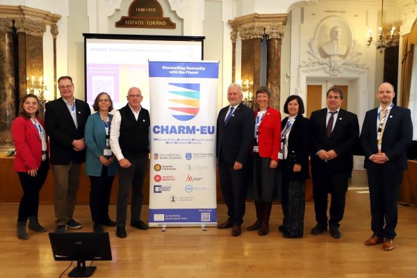 CHARM-EU Rectors, Meritxell Chaves and Ferenc Takó with the CHARM-EU roll-up at the Annual Confernece 2024 venue in ELTE