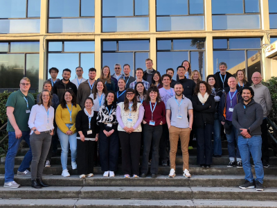 A group photo with all the participants of the Winter School 2026, in the stairs in front of the Faculty of Economics.