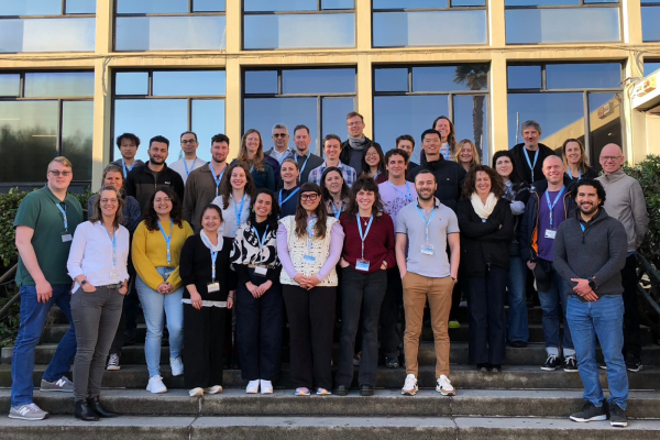 A group photo with all the participants of the Winter School 2026, in the stairs in front of the Faculty of Economics.